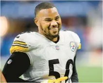  ?? ZACH BOLINGER/AP ?? Steelers linebacker Malik Reed walks off the field after a game Nov. 28 in Indianapol­is. He joins the Dolphins in free agency.