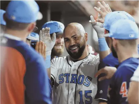  ?? AP PHOTO ?? AND THE BEAT GOES ON: Carlos Beltran and his Astros teammates celebrate Beltran’s two-run homer off struggling Red Sox starter Rick Porcello in the third inning of last night’s game in Houston.