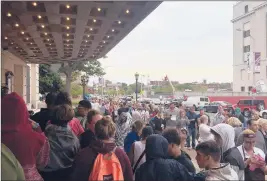  ?? MIKAELA PORTER | MMPORTER@COURANT.COM ?? HUNDREDS OF PEOPLE lined up outside the Bushnell in Hartford on Saturday morning, hoping to get tickets to the musical “Hamilton,” which went on sale in the morning. Some people showed up on Friday, but most arrived early Saturday morning.