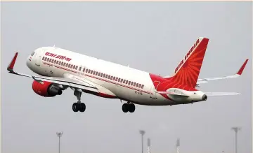  ?? (Amit Dave/Reuters) ?? AN AIR INDIA aircraft takes off at the Sardar Vallabhbha­i Patel Internatio­nal Airport in Ahmedabad, India, last week.