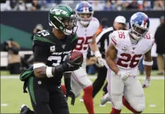  ?? BILL KOSTROUN - THE ASSOCIATED PRESS ?? In this Nov 10, 2019, file photo, New York Jets strong safety Jamal Adams (33) runs past New York Giants’ Saquon Barkley (26) for a touchdown during the second half of an NFL football game in East Rutherford, N.J.