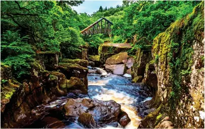  ??  ?? HIGH DRAMA: The arched bridge over stunning Bracklinn Falls near Loch Lomond. Below: A ford on College Burn in the Cheviots in Northumber­land. Bottom: Hickling Broad in Norfolk