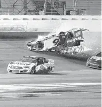  ?? AP ?? Ryan Newman’s No. 6 car lets off sparks while flipping on the track during a crash on the final lap of the 2020 Daytona 500. Thanks to safety innovation­s, Newman survived the horrific crash.