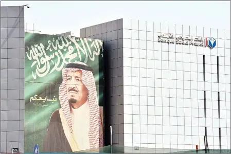  ?? (AFP) ?? A portrait of Saudi King Salman bin Abdulaziz is seen on Oct 18, in Riyadh.