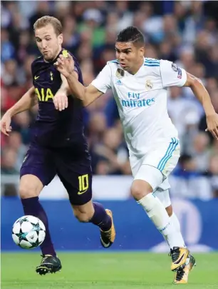  ??  ?? Harry Kane (10) of Tottenham Hotspur vies for the ball against Real Madrid’s midfielder Casemiro during the first leg of their UEFA Champions League match