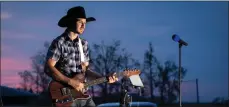  ??  ?? Saskatchew­an country musician Justin LaBrash during one of his drive-in concerts. He will perform at the 2020 Taking it to the Streets free drive-in concert in Swift Current, July 25.