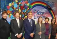  ?? PHOTO COURTESY OF THE MONTGOMERY BAR ASSOCIATIO­N ?? Montgomery County officials join Skippack artist Chelsea Allen for the unveiling of Allen’s new mural gracing the wall of Montgomery County Court Care March 23.