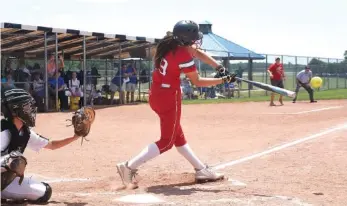  ?? STAFF PHOTOS BY ROBIN RUDD ?? Baylor’s Sydney Berzon makes contact during the Lady Red Raiders’ 4-3 win against rival GPS in the TSSAA Division II-AA softball state tournament Wednesday in Murfreesbo­ro.