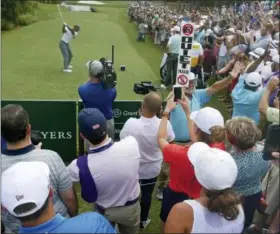  ?? JOHN RAOUX — THE ASSOCIATED PRESS ?? Tiger Woods tees off on the 10th hole during the third round of the The Players Championsh­ip golf tournament Saturday in Ponte Vedra Beach, Fla.