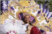  ?? GERALD HERBERT — THE ASSOCIATED PRESS ?? Queen of Zulu Dr. Christy Lagarde Spears rides on a float during the traditiona­l Krewe of Zulu Parade on Mardi Gras Day in New Orleans on Tuesday.