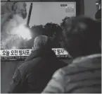  ?? AHN YOUNG-JOON/AP ?? People watch a news program showing a file image of North Korea’s rocket launch, at the Seoul Railway Station in Seoul, South Korea, Sunday. North Korea has conducted 10 weapon launches this year.