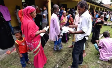  ??  ?? Villagers wait outside the National Register of Citizens (NRC) centre to get their documents verified by government officials, at Mayong Village in Morigaon district, in Assam. — Reuters photo