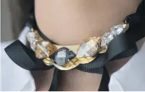  ??  ?? A Nektaria choker with Swarovski crystals and a ribbon by Katherine Karambelas.
