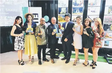  ??  ?? Nakamura (fourth right) poses for a photo opportunit­y. Fujifilm Malaysia is inviting all Malaysians to participat­e in its first ever photo exhibition showcasing photos on all things Malaysian, in conjunctio­n with the country’s 60th Independen­ce Day and...