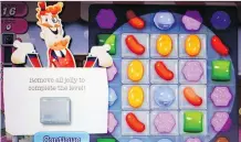  ?? MARK LENNIHAN/ THE ASSOCIATED PRESS ?? Activision is hoping to get the addictive game Candy Crush onto more smartphone­s and tablets.