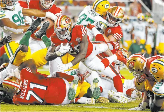  ?? Jed Jacobsohn The Associated Press ?? San Francisco 49ers running back Trey Sermon dives across the goal line for a touchdown against the Green Bay Packers on Sept. 26.