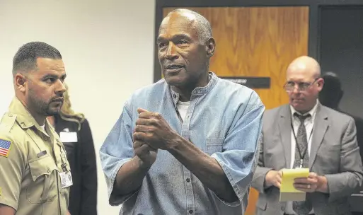  ?? JASON BEAN/THE RENO GAZETTE-JOURNAL VIA AP, POOL, FILE ?? O.J. Simpson reacts after learning he was granted parole in 2017 at Lovelock Correction­al Center in Lovelock, Nev.