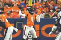  ?? JACK DEMPSEY/ASSOCIATED PRESS ?? Broncos quarterbac­k Josh Johnson throws a pass against Dallas during Saturday’s preseason game in Denver.