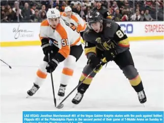  ?? —AFP ?? LAS VEGAS: Jonathan Marchessau­lt #81 of the Vegas Golden Knights skates with the puck against Valtteri Filppula #51 of the Philadelph­ia Flyers in the second period of their game at T-Mobile Arena on Sunday in Las Vegas, Nevada. The Flyers won 4-1.