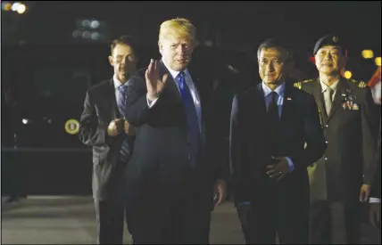  ?? AP PHOTO ?? President Donald Trump arrives at Paya Lebar Air Base for a summit with North Korean leader Kim Jong Un in Singapore.