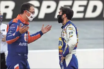  ?? AP - Mark Humphrey ?? Joey Logano (left) and Chase Elliott talk after last Sunday’s Cup race at Bristol. Logano and Elliott got tangled up late in the race, costing Elliott a chance for his second win in as many races.