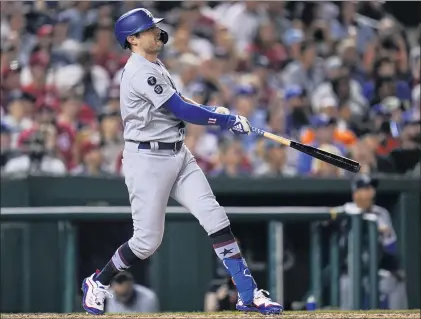  ?? PHOTOS BY JULIO CORTEZ — THE ASSOCIATED PRESS ?? The Dodgers’ AJ Pollock watches his two-run homer in the seventh inning that capped a nine-run rally in Friday night’s game at Washington.