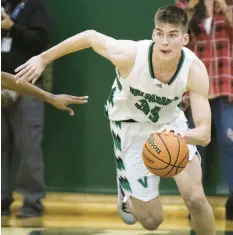  ?? MICHAEL GARD / POST-TRIBUNE ?? Valparaiso’s Mason Jones pushes the ball upcourt during a game against 21st Century.