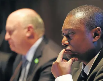  ?? Pictures: JAMES OATWAY ?? EQUAL PAY: Standard Bank joint CEOs Ben Kruger and Sim Tshabalala at the bank’s AGM this week