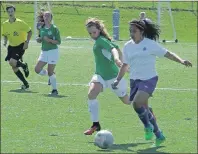  ??  ?? Ciera Oliver Dares of Nova Scotia, far right, breaks out down the sideline as Sophie Freeman of P.E.I. tries to defend in under-13 girls Atlantic championsh­ip action Friday at UPEI. The teams tied 2-2.