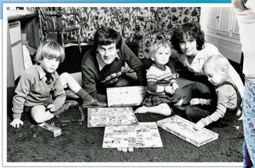  ?? ?? CAMP: Gyles Brandreth, right, as Lady Bracknell in The Importance Of Being Earnest, and, above, with wife Michèle, their son Benet and daughters Saethryd and Aphra