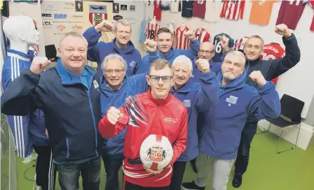  ??  ?? GB Special Olympic footballer Liam Lister at Fans Museum, where he’s an ambassador, withmuseum founder Michael Ganley, left, and the volunteer team. Below, Liam with his mam June.