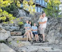  ??  ?? Kootenay Lake Village developer Oliver Berkeley and spouse Siara, with their children, left to right, Maxi, Samson and Olivia.