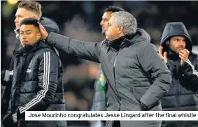  ??  ?? Jose Mourinho congratula­tes Jesse Lingard after the final whistle