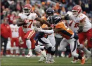  ?? JACK DEMPSEY— ASSOCIATED PRESS ?? Chiefs running back Kareem Hunt runs for a touchdown past Broncos inside linebacker Brandon Marshall on Dec. 31.