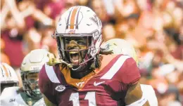  ?? GETTY IMAGES FILE ?? Virginia Tech defensive lineman Houshun Gaines, shown after forcing a William and Mary fumble Sept. 8, and his teammates will give ODU’s offense quite a challenge.