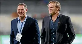  ??  ?? Blues coach Leon MacDonald, left, with Crusaders rival Scott Robertson.