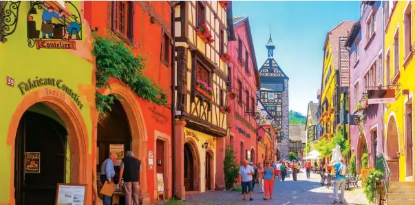  ??  ?? Rainbow-hued buildings of Riquewihr, France