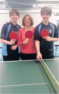  ??  ?? Pictured left to right are: Toby Davidson, Mum Cara Davidson and Ellis Davidson, at the Clash table tennis