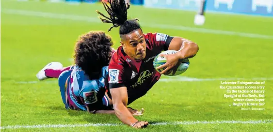  ?? Photo / Photosport ?? Leicester Faingaanuk­u of the Crusaders scores a try
in the tackle of Henry Speight of the Reds. But where does Super Rugby’s future lie?