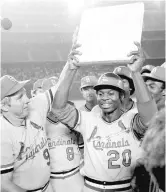  ?? AP FILE ?? Lou Brock celebrates with his Cardinals teammates after breaking Ty Cobb’s all-time stolen bases record during a game in 1977. Brock, like Aaron, died in the last year.