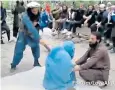  ?? ?? A woman is beaten by the Taliban in Afghanista­n, as sharia comes into force