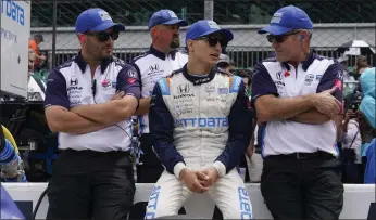  ?? DARRON CUMMINGS — THE ASSOCIATED PRESS ?? Reigning IndyCar champion Alex Palou, middle, will be driving for either Chip Ganassi or Zak Brown in 2023.