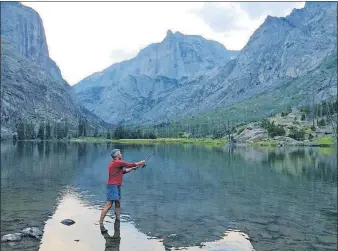  ?? [BEN YEOMANS VIA AP] ?? Mike Eckel fishing for trout in Elk Lake in Montana’s Absaroka-Beartooth Wilderness