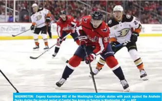  ??  ?? WASHINGTON: Evgeny Kuznetsov #92 of the Washington Capitals skates with puck against the Anaheim Ducks during the second period at Capital One Arena on Sunday in Washington, DC. — AFP