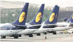  ??  ?? Jet aircraft stand on tarmac at the domestic airport terminal in Mumbai, India. India’s corporate affairs ministry is probing allegation­s that beleaguere­d carrier Jet siphoned off funds, the Business Standard newspaper reported on Tuesday. — Reuters photo