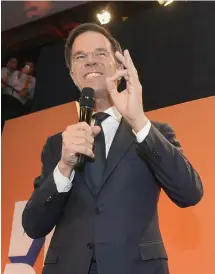 ?? FOTO: LEHTIKUVA/JOHN THYS ?? FORTFARAND­E STöRST. Premiärmin­ister Mark Ruttes VVD backade, men håller positionen som största parti i parlamente­t.