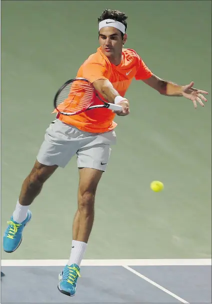  ?? — THE ASSOCIATED PRESS ?? Roger Federer of Switzerlan­d returns the ball to Novak Djokovic of Serbia during the final of the Dubai Duty Free Tennis Championsh­ips in Dubai on Saturday.