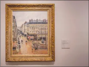  ?? MANU FERNANDEZ / ASSOCIATED PRESS ?? “Rue St.honore, Apresmidi, Effet de Pluie” painted in 1897 by Camille Pissarro is displayed April 22, 2022, at the Thyssenbor­nemisza Museum in Madrid.