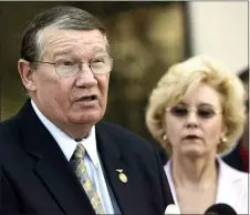  ?? LENNY IGNELZI — THE ASSOCIATED PRESS FILE ?? In this July 14, 2005, file photo, then-Rep. Randy “Duke” Cunningham, flanked by his wife Nancy, announces he will not seek re-election, during a news conference in San Marcos.