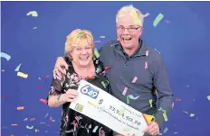  ?? SUPPLIED PHOTO ?? Sandra and Bob Donladson of Smithville celebrate their $23-million lottery win at the Ontario Lottery and Gaming prize office in Toronto.